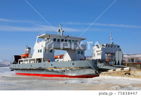 Cargo-passenger ferry frozen in ice on the shore of Lake Baikal Cargo-passenger ferry frozen in ice on the shore of Lake Baikal 75838447