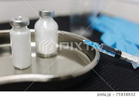 Covid-19 drug vaccine vials medicine bottles syringe injection. Corona Virus infection. Medical concept 75838632