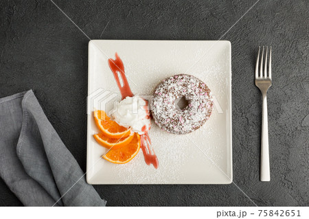 doughnut on plate isolated on black background doughnut on plate isolated on black background 75842651