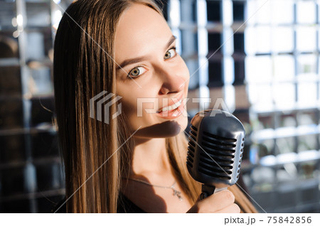 Beautiful Singing Girl. Beauty Woman with Microphone. Glamour Model Singer. Karaoke song. 75842856