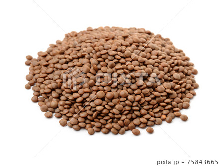 Pile of dry brown lentils 75843665