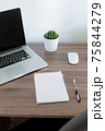 Office at home. LaptOffice at home. Laptop. notebook. pen are on the table.op. notebook. pen are on the table. 75844279