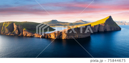 Sorvagsvatn lake on cliffs of Vagar island in sunset, Faroe Islands 75844675