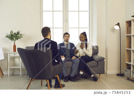 Young couple trying to resolve family conflict with help of professional therapist 75845253