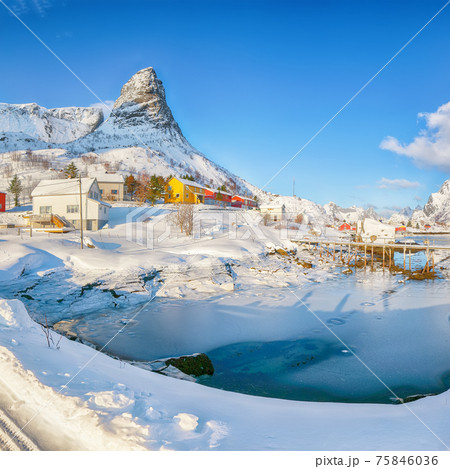 Fabulous winter sunny view on Hammarskaftet Mountain Peak with footbridge above Gravdalbukta bay 75846036