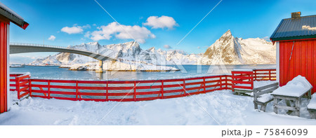 Fantastic winter view on Hamnoy village and bridge to Olenilsoya island. 75846099