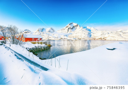 Captivating winter view of  fishing village on Sundstraumen strait 75846395