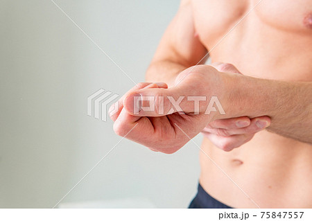 Measures Pulse on the hand of a white man in the background pain body painful, cramp person health medicine, muscular holding. red disease suffer attractive Measures Pulse on the hand of a white man in the background pain body painful, cramp person health medicine, muscular holding. red disease suffer attractive 75847557