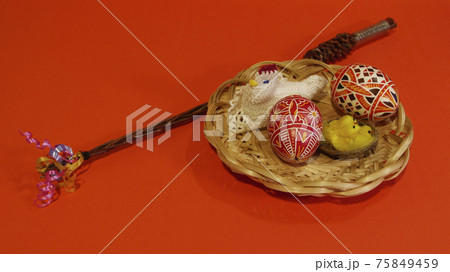 Czech rod with differently colored Easter eggs, red background 75849459