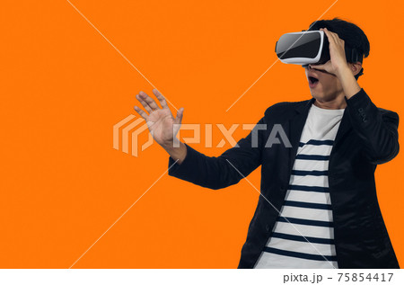Young man with virtual reality headset. Young man with virtual reality headset. 75854417