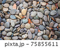 River gravel in the sun during the day on top view with vignette effect. 75855611