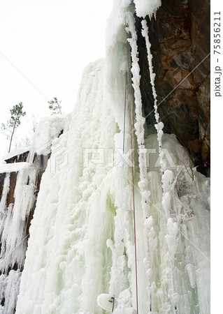 Frozen waterfall from a stone cliff in the national park. Frozen waterfall from a stone cliff in the national park. 75856211
