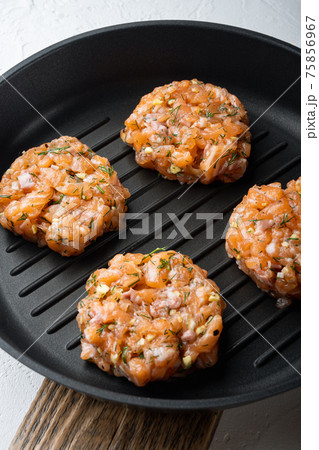 Quick asian raw fishcakes, on white textured background 75856967