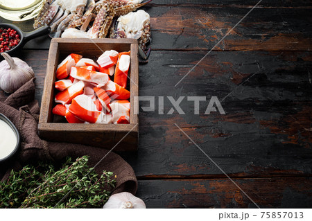 Fresh Crab meat stick surimi , in wooden box, on dark wooden background , with copyspace and space for text Fresh Crab meat stick surimi , in wooden box, on dark wooden background , with copyspace and space for text 75857013