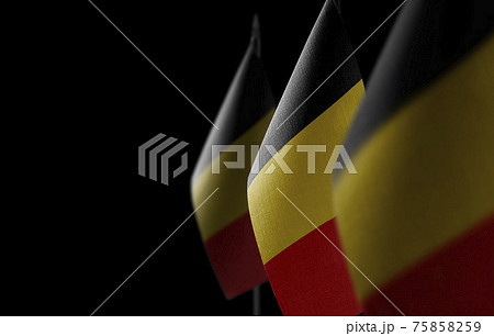 Small national flags of the Belgium on a black background Small national flags of the Belgium on a black background 75858259