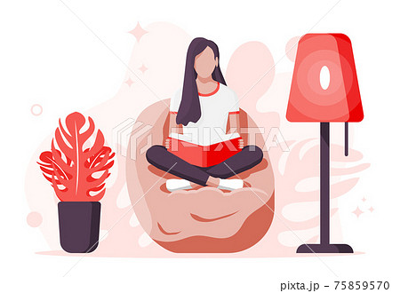 Young woman sitting cross-legged and read book. 75859570