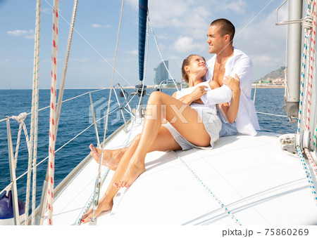 Couple enjoying sea trip along coast of Barcelona 75860269