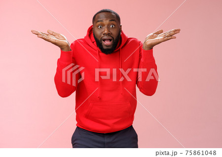 Excited passionate emotive african-american male discussing shocking match moment retelling amusing story cannot get clue how team lost shrugging hands spread sideways dismay look confused 75861048