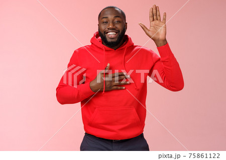 Smiling friendly african-american sincere man raise palm hold hand heart swearing loyalty pledging oath make promise standing positive pink background cheerfully grinning Smiling friendly african-american sincere man raise palm hold hand heart swearing loyalty pledging oath make promise standing positive pink background cheerfully grinning 75861122