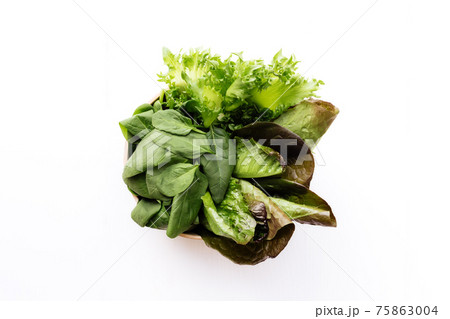 Bowl with salad leaves of spinach, lettuce, romaine on white background Bowl with salad leaves of spinach, lettuce, romaine on white background 75863004