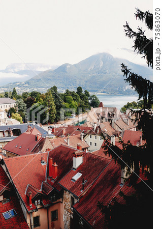 Annecy city top view, lake in the distance. Tile roofs, Cathedral Annecy city top view, lake in the distance. Tile roofs, Cathedral 75863070