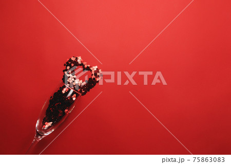 Valentine with wine glass, heart glitter on red background Valentine with wine glass, heart glitter on red background 75863083