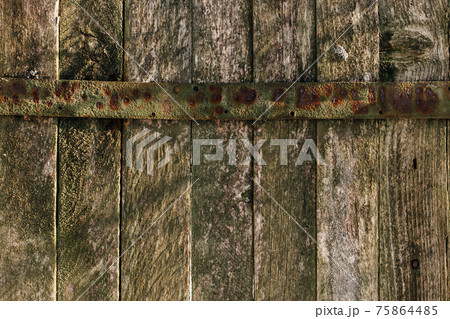 Background with old wooden fence with metal curtain. Old boards texture 75864485