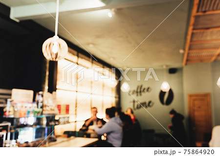 Blurred loft coffee shop with barista and customer 75864920