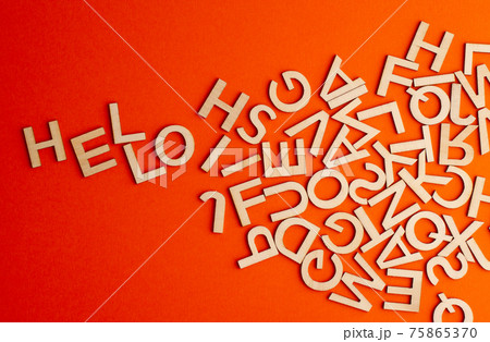 wooden cut alphabet letters on orange background spelling the word hello wooden cut alphabet letters on orange background spelling the word hello 75865370