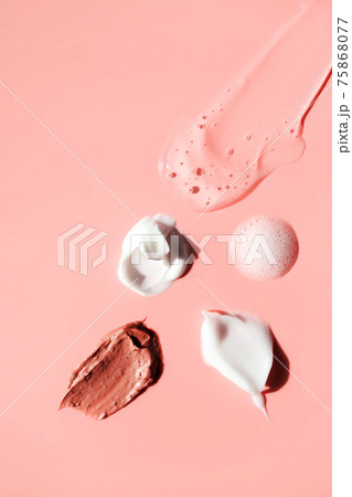 Various cosmetic smears on a pink background 75868077
