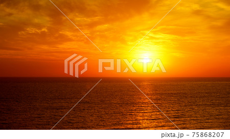 Fantastic ocean and sunset sky in red colors. Fantastic ocean and sunset sky in red colors. 75868207