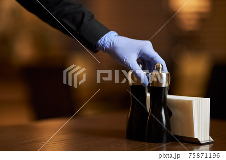 Using gloves while serving tables is a must during pandemic Using gloves while serving tables is a must during pandemic 75871196