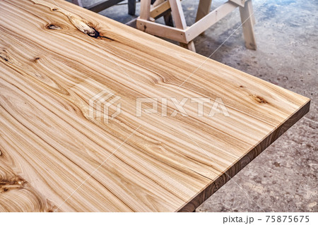 Live edge elm countertop in workshop close-up Live edge elm countertop in workshop close-up 75875675