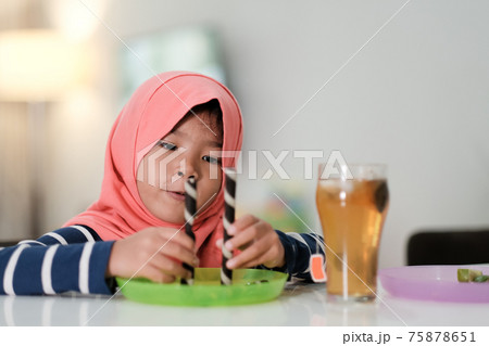 happy muslim girl are playing breakfast dessert happy muslim girl are playing breakfast dessert 75878651