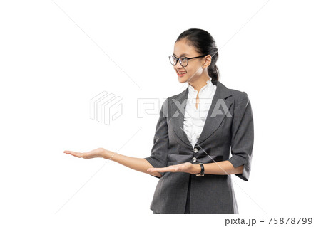 Beautiful businesswoman asian smiling presenting something over white Beautiful businesswoman asian smiling presenting something over white 75878799