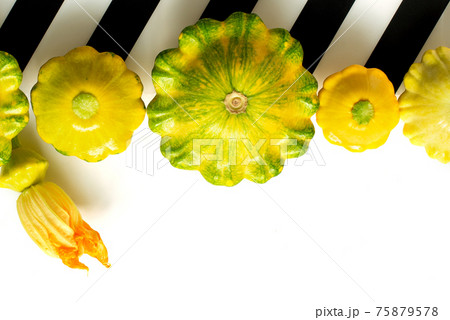 Patisson, Squash, dish-shaped pumpkin, raw vegetable on a dark wooden background. 75879578