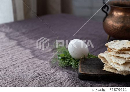 Homemade matzo with microgreen peas. Unleavened flatbread bread. Pesah celebration concept. Jewish Passover background. Pita. 75879611