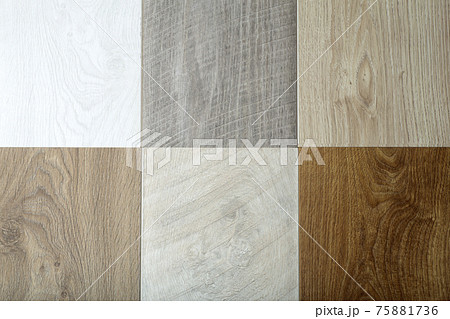 Laminate background. Samples of laminate or parquet with a pattern and wood texture for flooring and interior design. Production of wooden floors. Laminate background. Samples of laminate or parquet with a pattern and wood texture for flooring and interior design. Production of wooden floors. 75881736