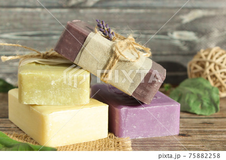 soap of light shades from natural ingredients on a wooden surface soap of light shades from natural ingredients on a wooden surface 75882258