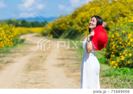 Beautiful woman in nature flower. Beautiful woman in nature flower. 75889006