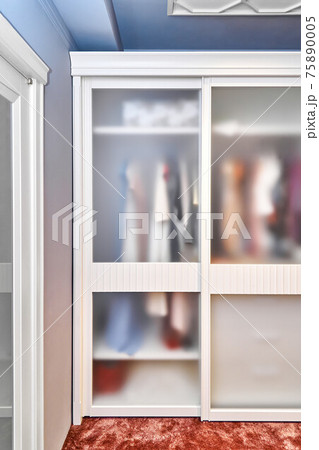 Large wardrobe with matte glass on doors in wooden house Large wardrobe with matte glass on doors in wooden house 75890005