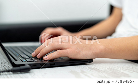 Man using laptop at home 75894957