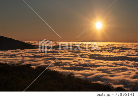 a spectacular sunset above the clouds in the national Park of the volcano Teide on Tenerife. Excellent sunset in the Canary Islands a spectacular sunset above the clouds in the national Park of the volcano Teide on Tenerife. Excellent sunset in the Canary Islands 75895141