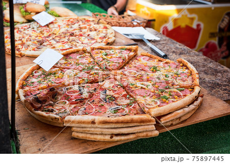 Closeup of pizza in street fast food cafe 75897445
