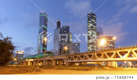 Moscow Central Circle (Little Ring, MCC,or MK MZD) and skyscrapers of the International Business Center (City) at night, Russia. Delovoy Tsentr railway station Moscow Central Circle (Little Ring, MCC,or MK MZD) and skyscrapers of the International Business Center (City) at night, Russia. Delovoy Tsentr railway station 75898744