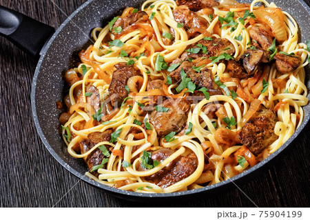 pasta linguine with fried chicken liver, top view pasta linguine with fried chicken liver, top view 75904199
