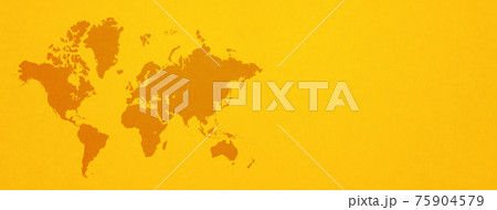 World map on yellow wall background. Horizontal banner 75904579