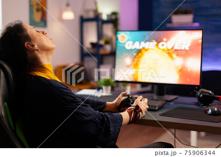 Player woman winning space shooter game 75906344