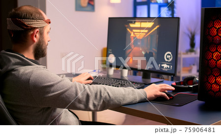 Caucasian man playing online video games for virtual championship 75906481