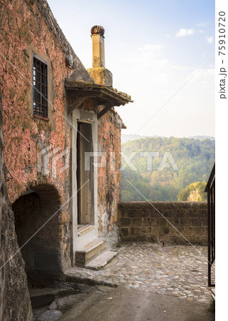 View of the mountain valley from the abandoned house in medieval commune town of Calcata, Italy 75910720